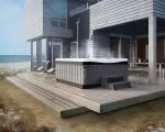 Thumnbail of Caldera spa set up on decking at beach house