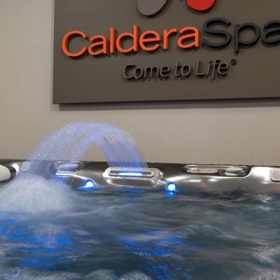 Caldera Spas sign in background, close up of spa in foreground