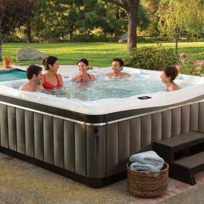 Five people enjoying Caldera hot tub spa