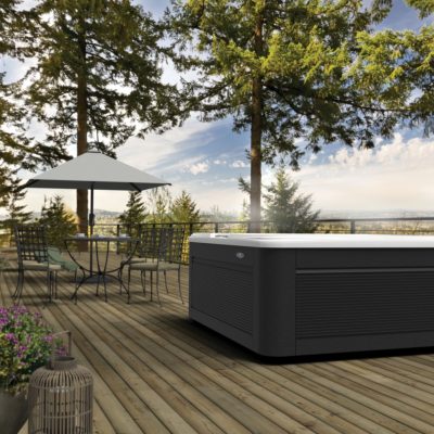 Caldera spa on decking with mountain view