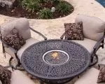 Thumnbail of Outdoor lounge furniture with fire pit in table and chairs surrounding