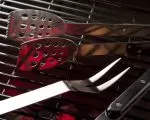 Thumnbail of grill accessories resting on grill