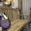 Wooden bench with electric guitar