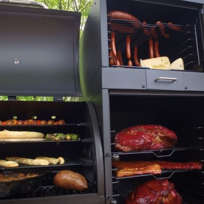 Large pellet grill showing all types of food that can be cooked on it