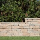 Retaining wall blocks between lawn and trees