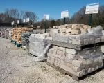 Thumnbail of Pallets of landscaping slabs and stones on display at Outdoor Living store