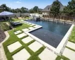 Thumnbail of Landscaping stone features and retaining wall around swimming pool